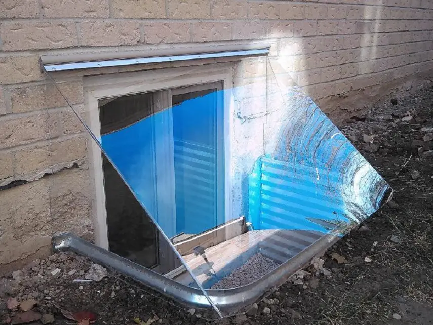 plexiglass Window well cover installed on an egress window