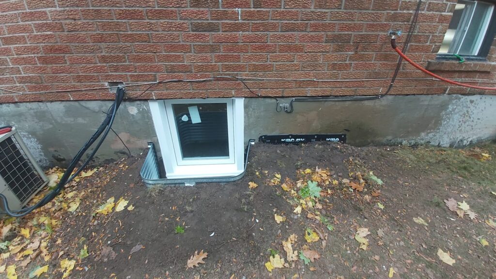 Egress window with pressure-treated wood window well, Whitby
